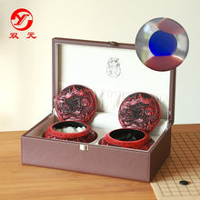 Load image into Gallery viewer, Songyun single convex glass stones, transparent deep sea blue, in lacquer bowls with carved landscapes, with  leather storage box and Imitation leather foldable 19-line board
